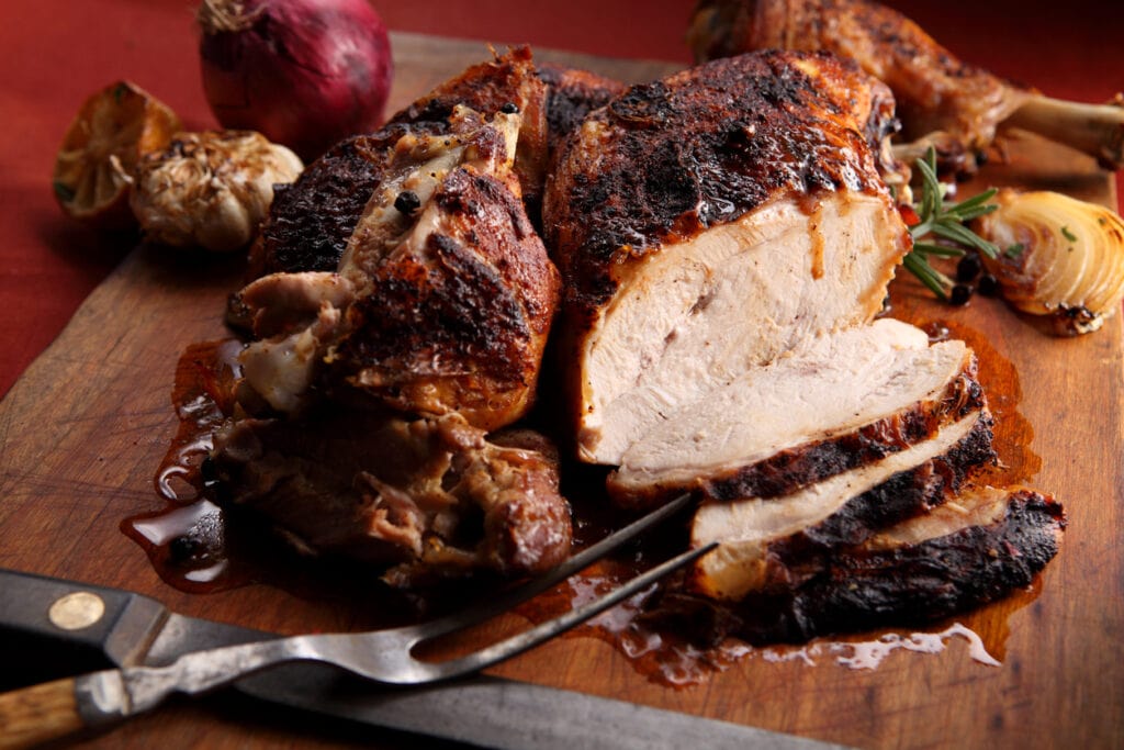 sliced deep fried turkey on cutting board