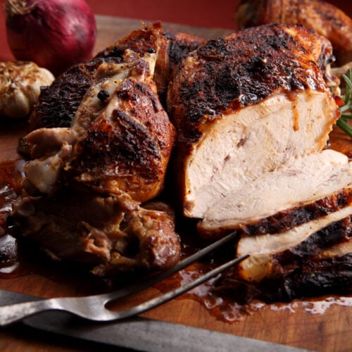 sliced deep fried turkey on cutting board
