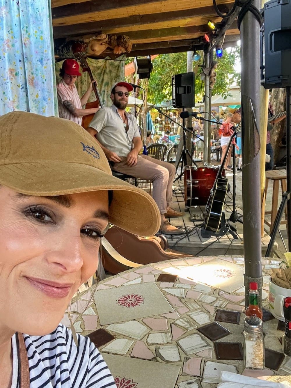 Stacy Lyn sitting outdoors at Blue Heaven, Key West Florida