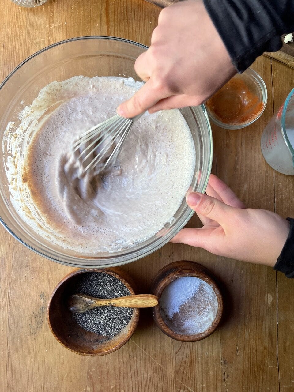 cauliflower sauce ingredients whisked in glass bowl