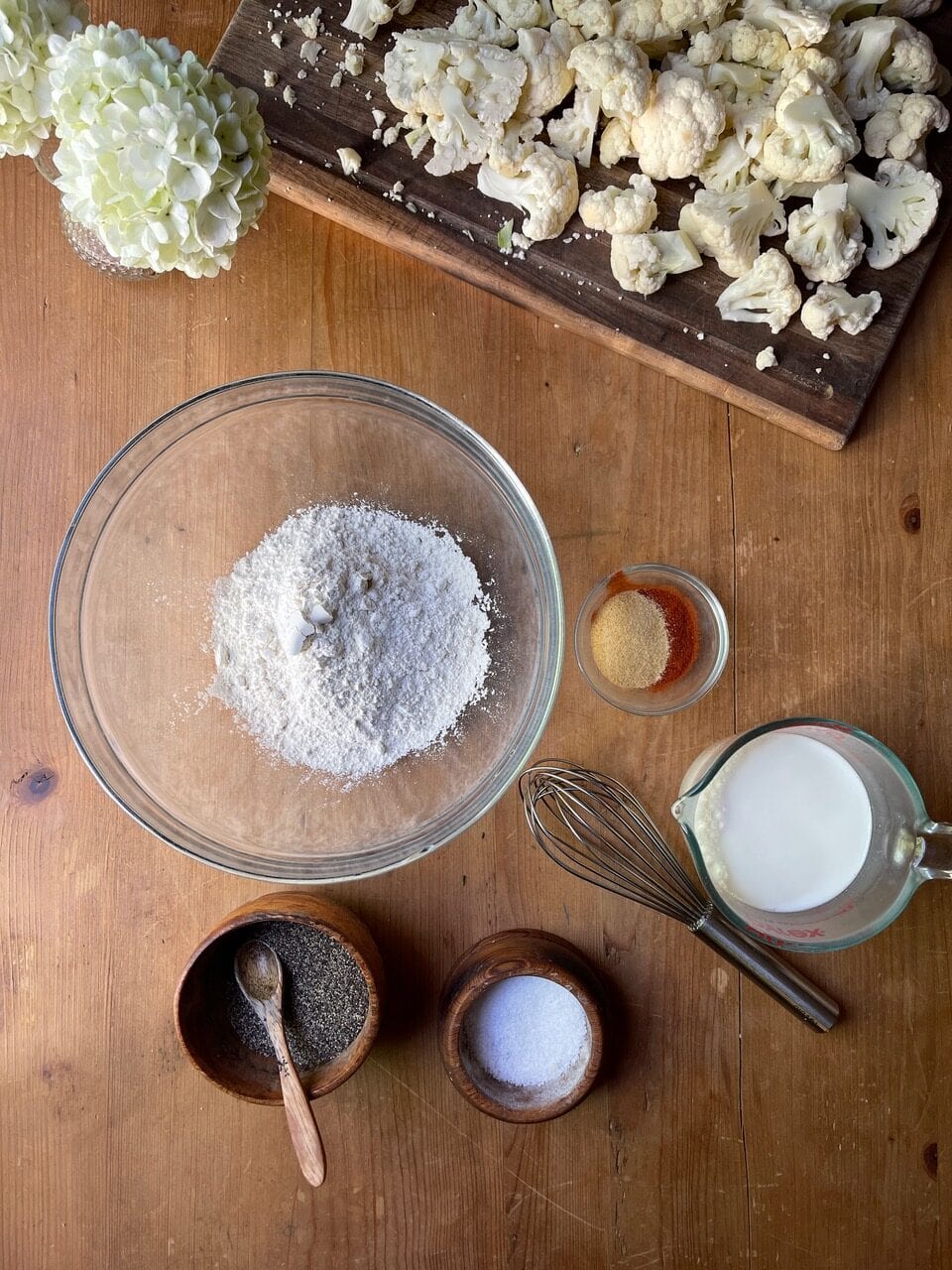 flour, salt, seasonings in small dishes on counter