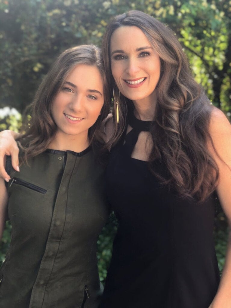 Stacy Lyn standing with her arm around daughter - Mother's Day portrait