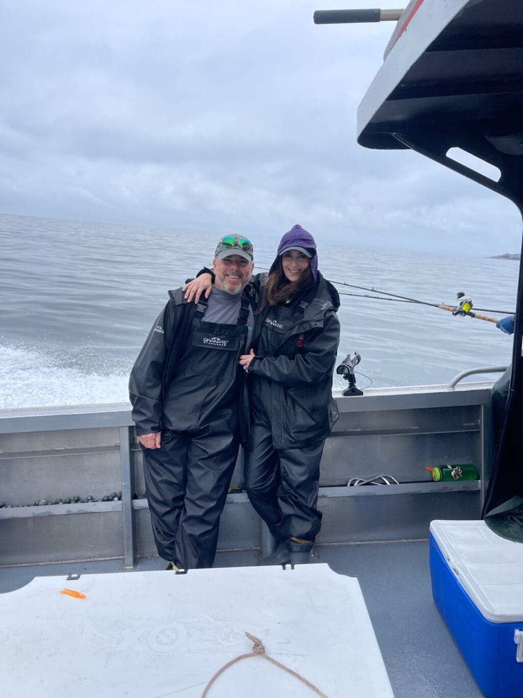 Scott and Stacy Lyn on boat in Alaska with fly fishing equipment