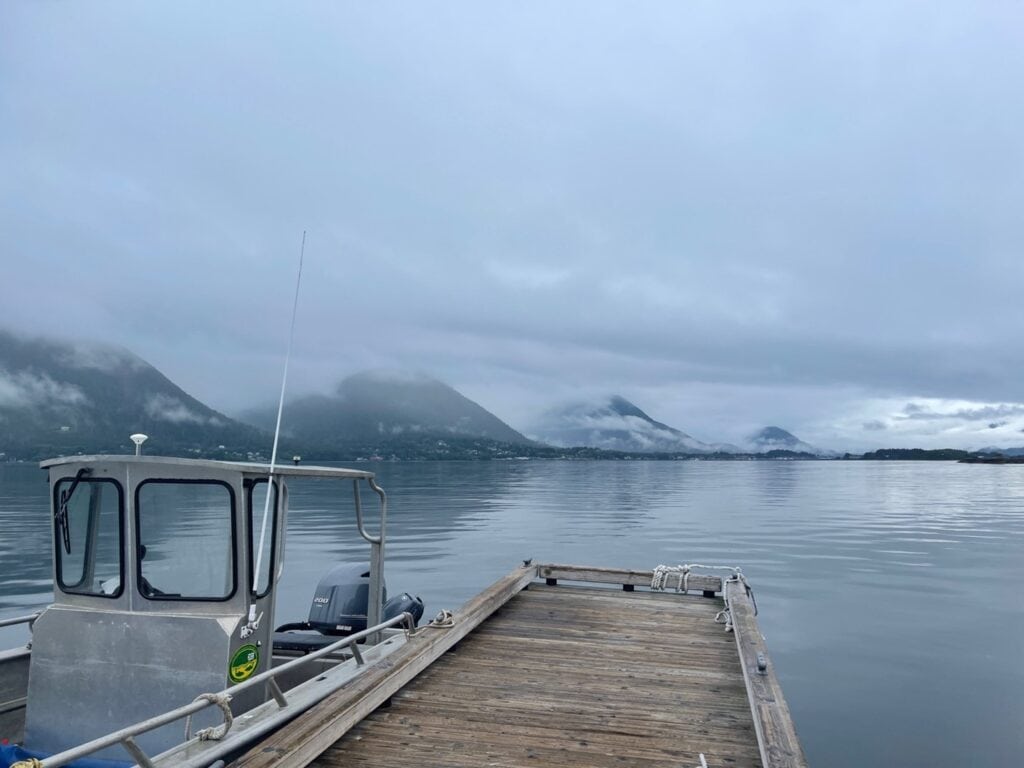 traveling by boat to Talon Lodge - view from dock with mountains in distance