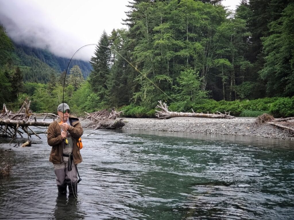 fly fishing side view - Scott Harris catching fish
