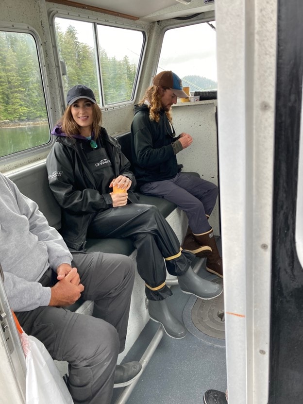 traveling by ATV to explore Alaska: Stacy Lyn in ball cap and fishing gear on ATV