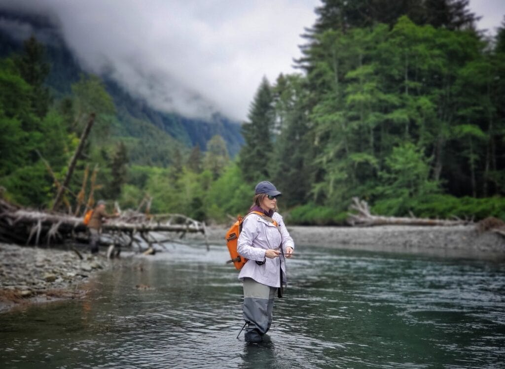 Stacy Lyn fly fishing in creek in Sitka, Alaska