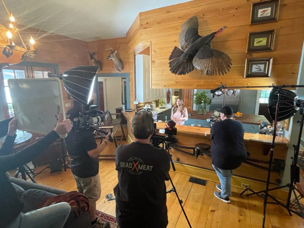 Stacy Lyn at kitchen counter, filming for episode of Sporting Chef