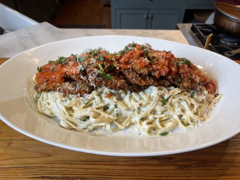 Fettucine Alfredo Topped with Crispy Venison Parmesan and Marinara