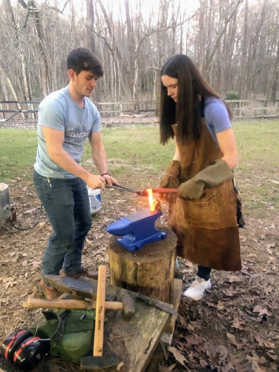 Stacy Lyn's daughter Milly learning to forge iron