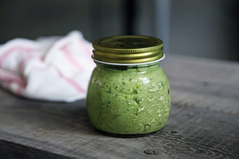 small, sealed mason jar full of basil pesto