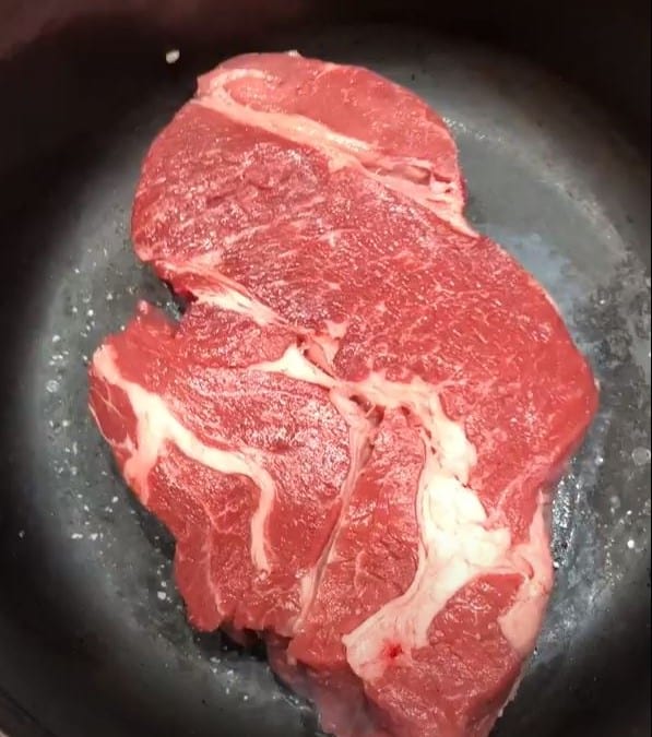 beef chuck roast ready to brown in Dutch oven