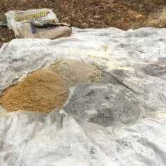 tarp on ground with two parts sand to one part clay