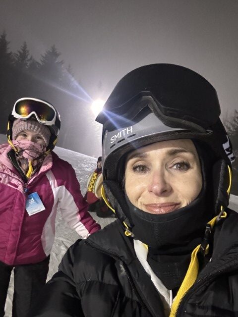 Stacy Lyn skiing with kids at night