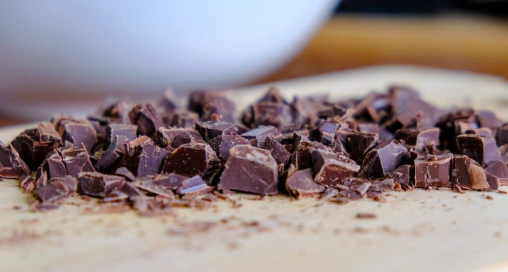 dark chocolate chunks chopped for cookies on cutting board