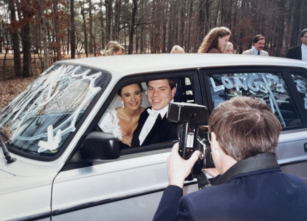 Stacy Lyn and Scott driving off after their wedding