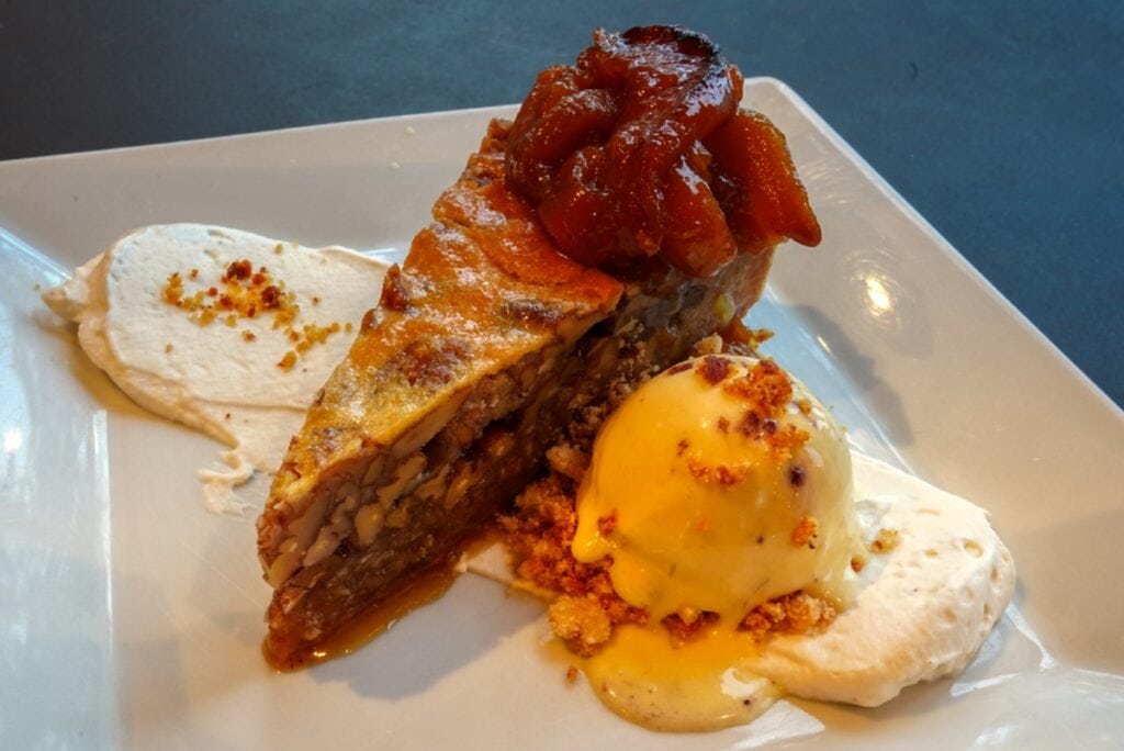 elegantly plated pecan pie in Alaskan lodge dining room