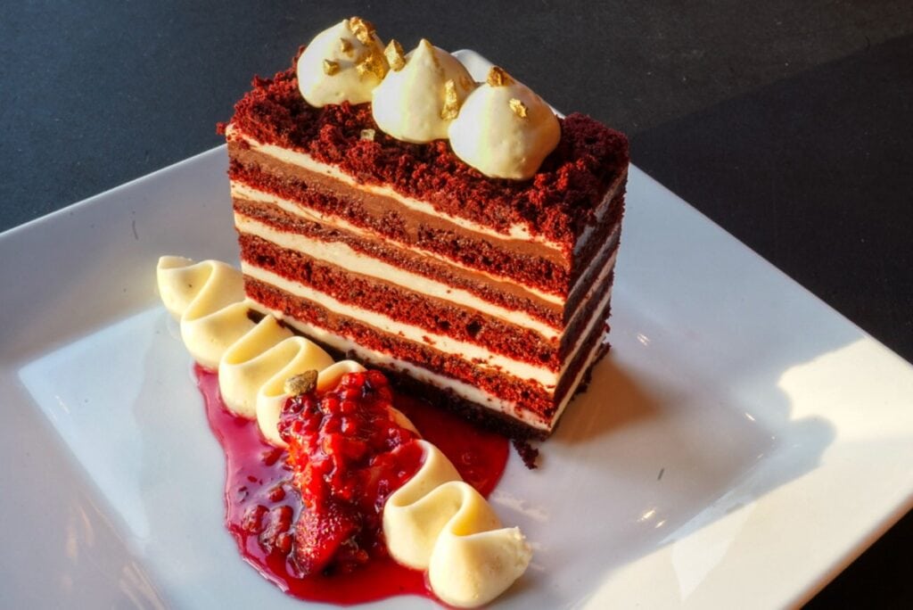 red velvet cake served on square white plate