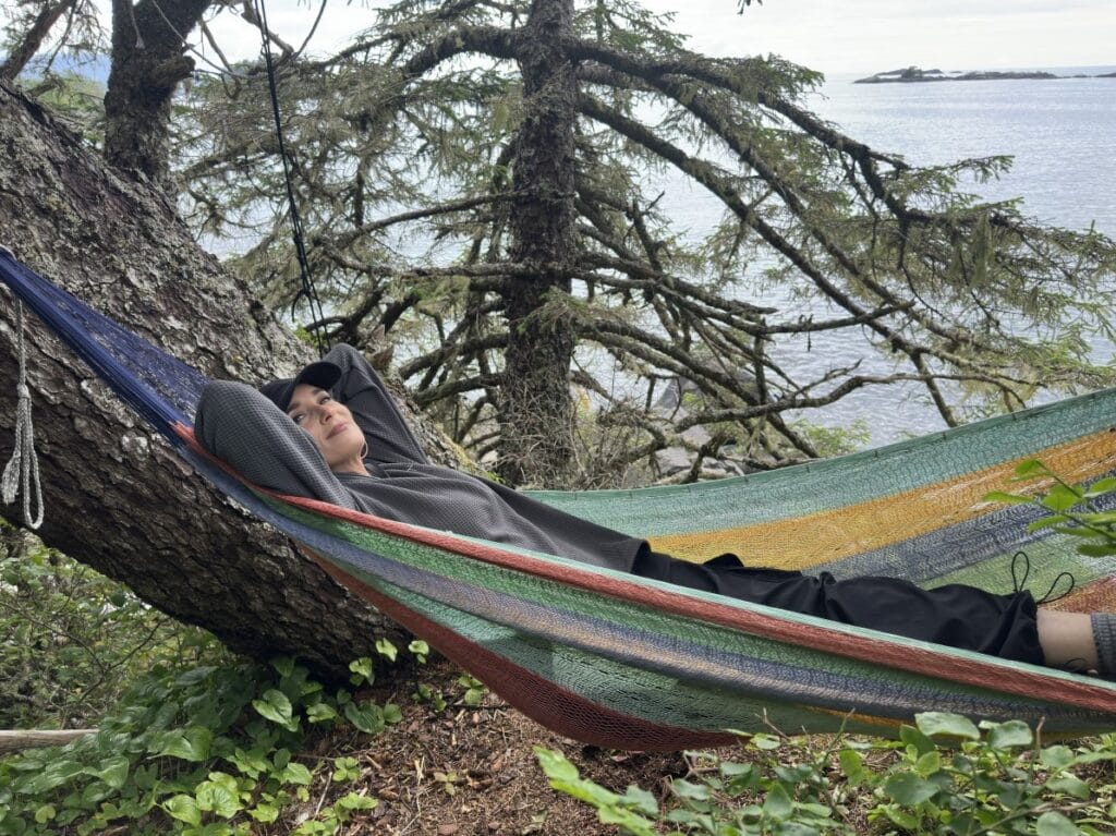 Stacy Lyn relaxing in hammock in trees