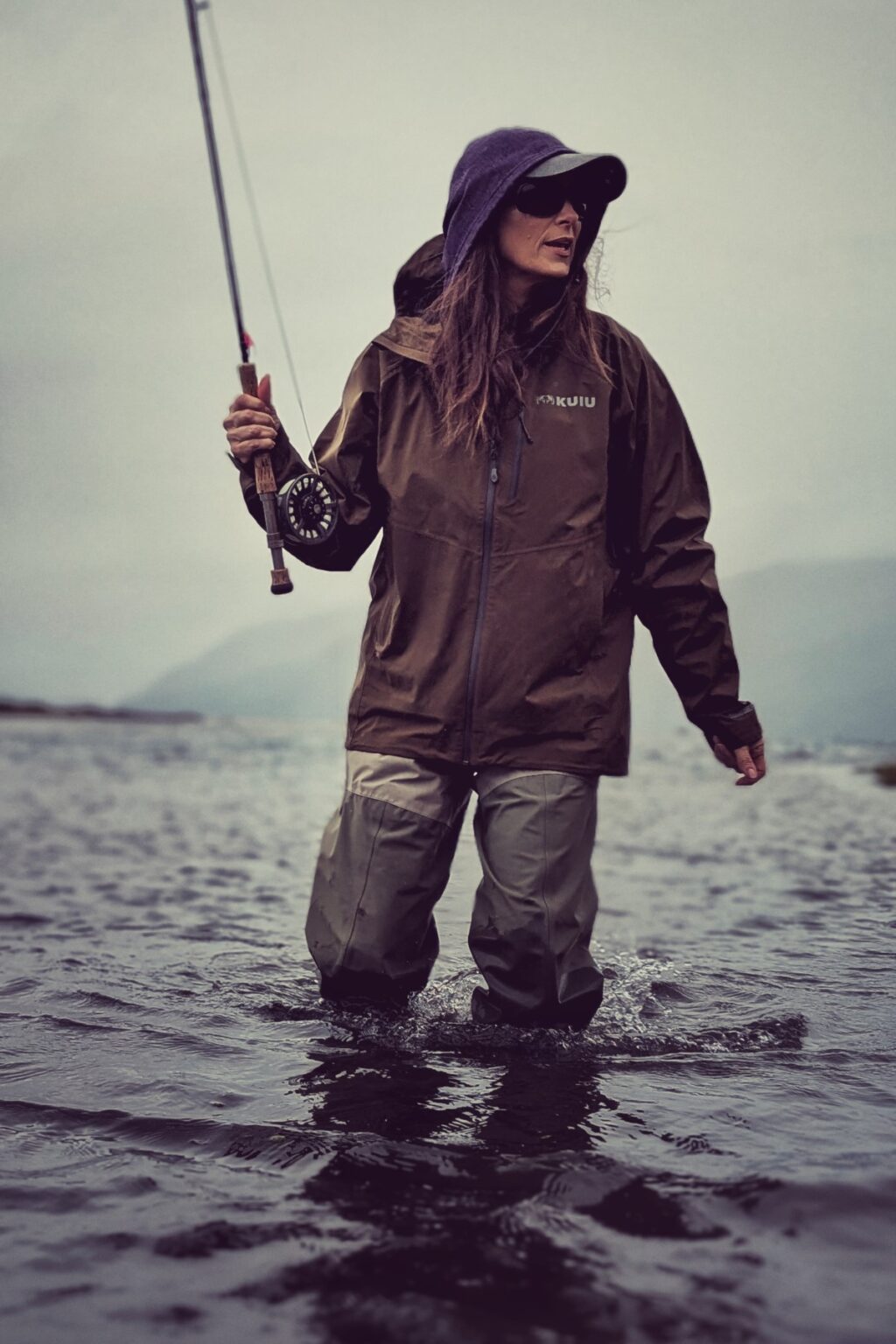 Stacy Lyn fly casting in Alaskan river near Sitka