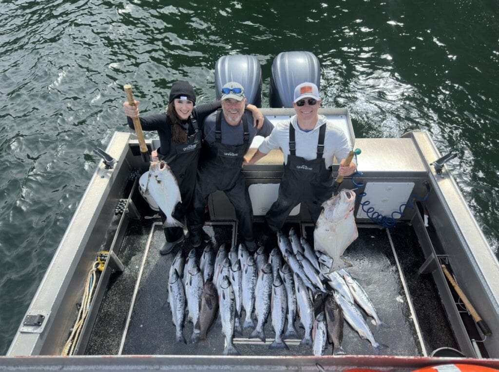 Stacy Lyn, Scott, and Howlett on deep sea fishing boat in Sitka Alaska waters