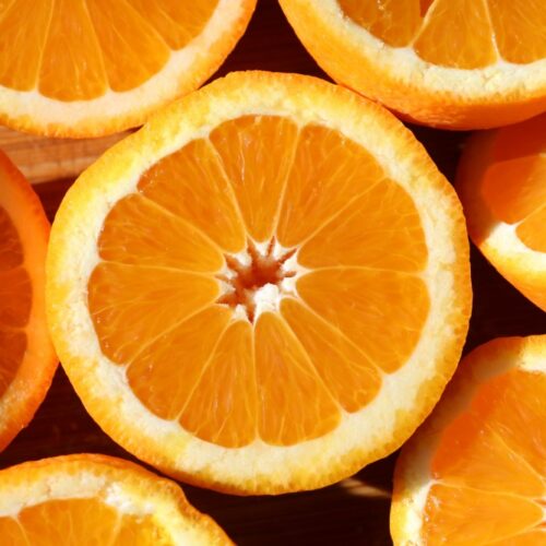 sliced oranges, cut side up and close together