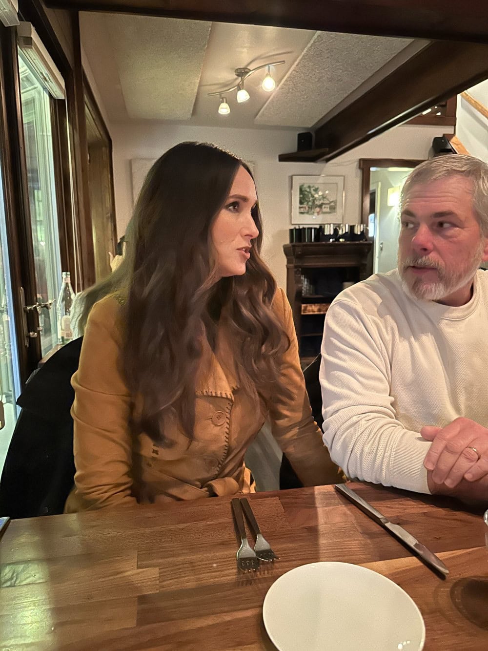 Stacy Lyn in goatskin jacket at restaurant with Scott