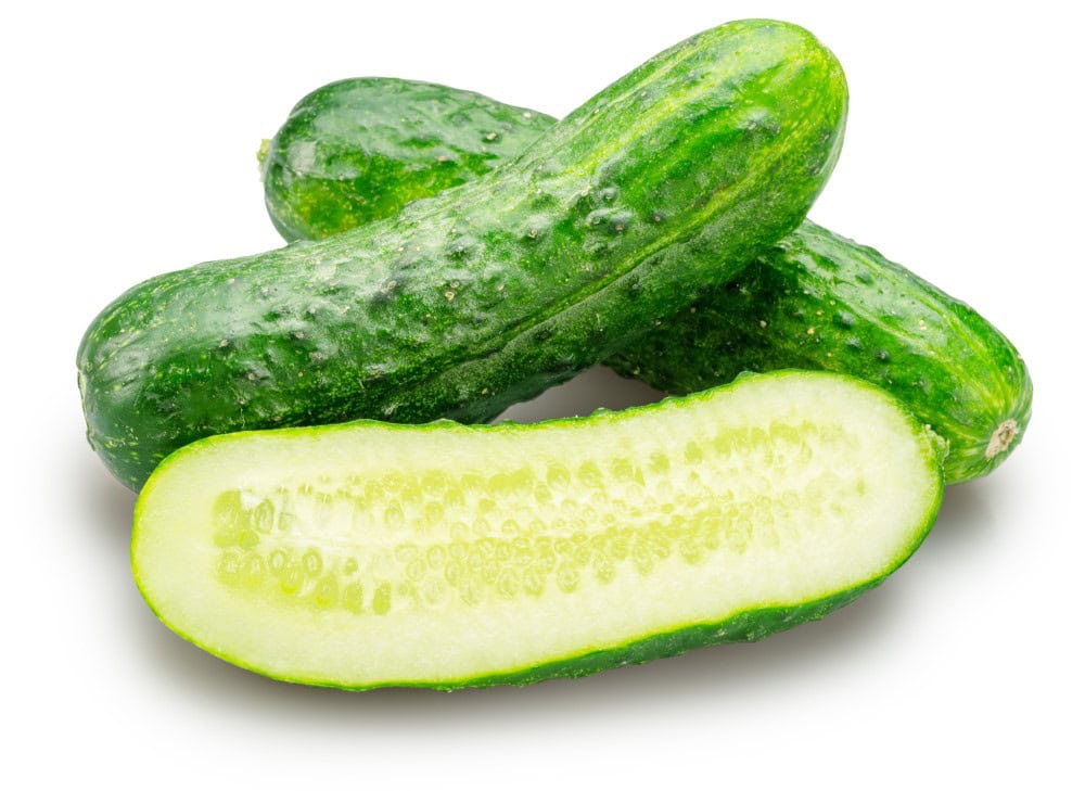 3 fresh cucumbers with front vegetable sliced vertically