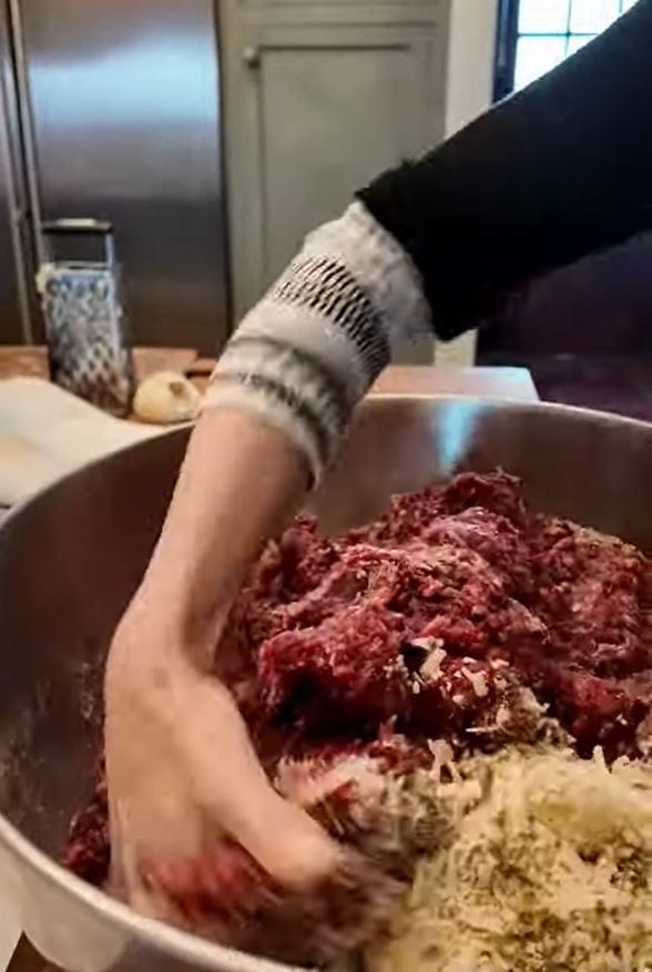 stacy lyn making meatball mixture
