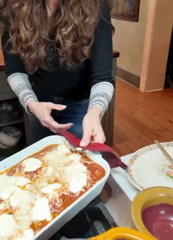 stacy lyn taking meatball casserole out of oven