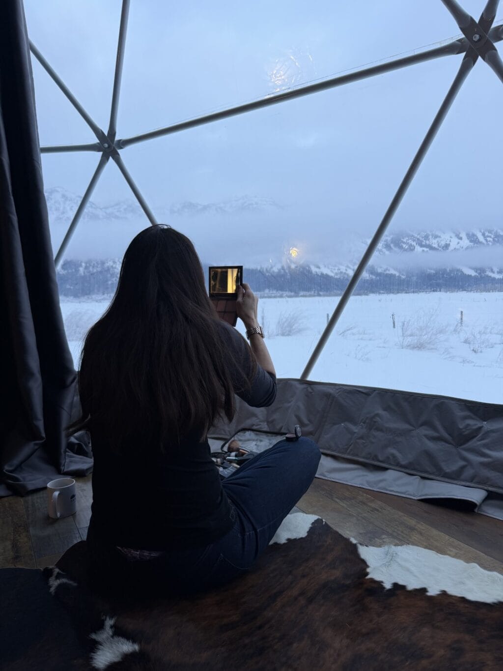 Stacy Lyn photographing incredible view from yurt