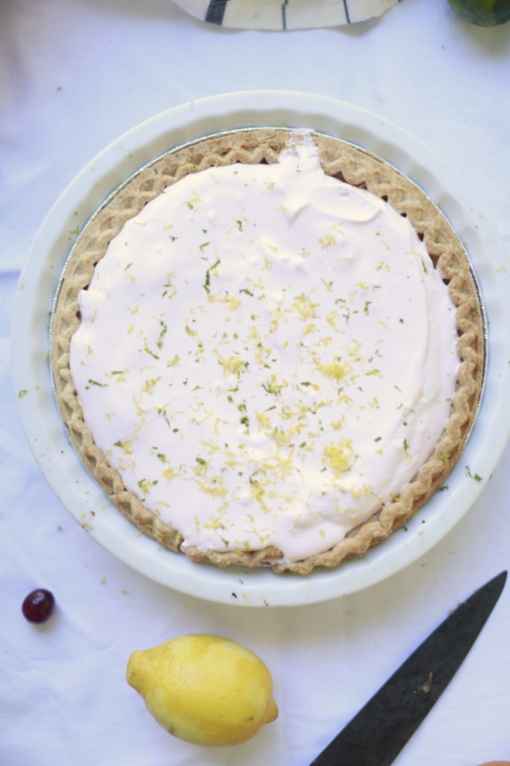 whole lemon icebox pie with whipped cream topping